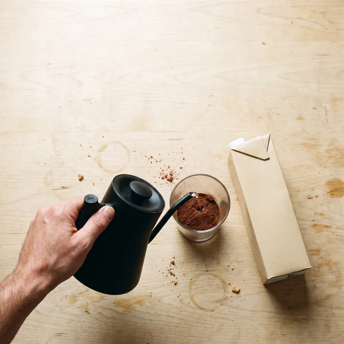 Pour the hot water over the powder